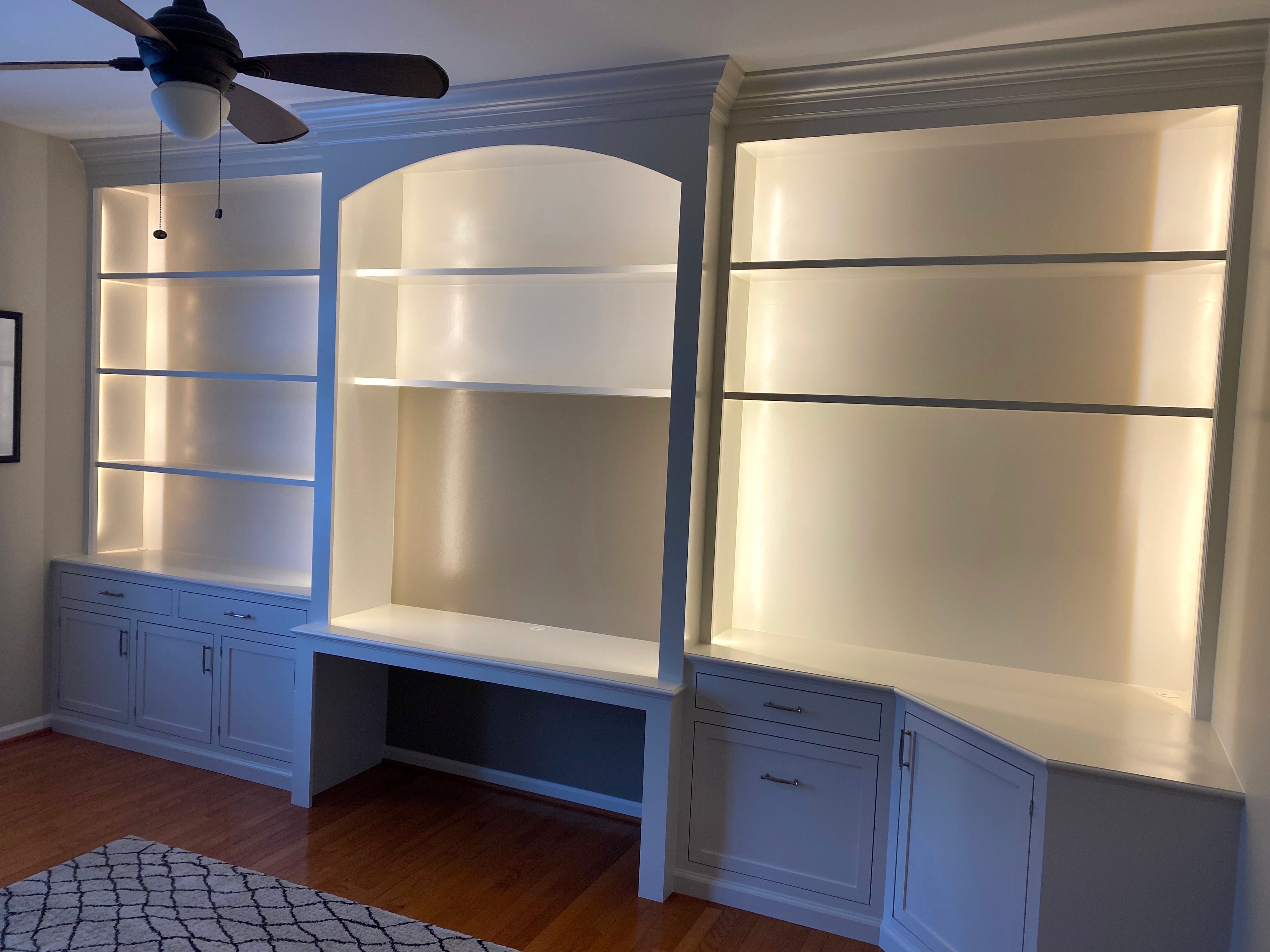 Integrated lighting enhances your custom shelving